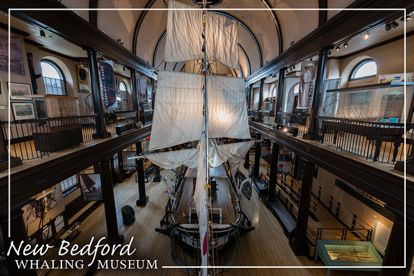Interior view of the New Bedford Whaling Museum featuring a large model of a whaling ship.